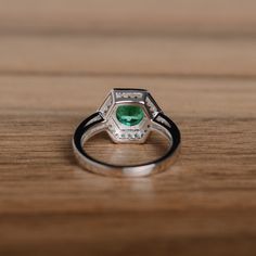 It is a genuine emerald ring(lab emerald). The emerald is 7mm*7mm round, weight about 1.29 carats. The basic metal is sterling silver and plated with rhodium. To change the metal to a solid gold (white/rose) or platinum is also available, please ask for a quotation if you want. You can also go to my shop Home for more elegant rings: https://www.etsy.com/shop/godjewelry?ref=hdr_shop_menu Emerald is May birthstone. More emerald rings: https://www.etsy.com/shop/godjewelry?ref=hdr_shop_menu&sect Anniversary Rings For Her, Emerald Wedding, Engagement Anniversary, Elegant Ring, Emerald Engagement Ring, Rings For Her, Emerald Ring, Birthstone Ring, Promise Rings