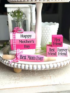 a mother's day gift set on a cake plate