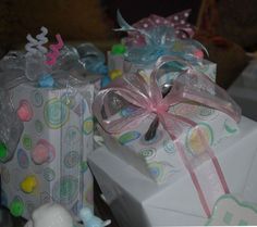 two wrapped gift boxes with ribbons and bows