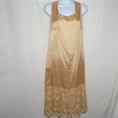 Vintage 60s/70s Peach Taffeta Lace Tea Party Dress L Sleeveless Tank Gatsby Downton 20s Brand: Endien Ltd. New York Paris Made In Usa Tag Size: 14 = Measures Large Taffeta With Wide 13" Gold Brocade Scalloped Lace Hem Measurements: Chest: 20" Across Underarms Waist: 19" Hips: 21" Length: 45" Shoulder To Hem Excellent Vintage Condition, Does Have Light Stains That Should Come Out With Proper Cleaning Item#000/050721 Features: Dress Size: Womens L Condition: Pre-Owned Good Sleeveless Silk Dress With Lace Trim, Elegant Sleeveless Vintage Dress For Spring, Apricot Sleeveless Evening Dress, Sleeveless Retro Vintage Dress With Lace Trim, Retro Sleeveless Vintage Dress With Lace Trim, Spring Vintage Sleeveless Dress For Parties, Spring Wedding Sleeveless Vintage Dress, Vintage Satin Summer Dresses, Vintage Apricot Party Dress