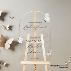 a wooden easer with butterflies on it and the words welcome to amanda's bride