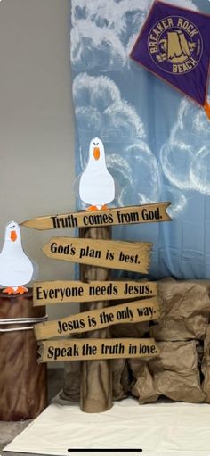 a group of wooden signs sitting on top of a table