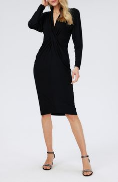 A timelessly chic dress is shaped with a center twist and turned out in beloved black. Deep V-neck Long sleeves 95% Lenzing™ EcoVero™ viscose, 5% spandex Lenzing EcoVero viscose is a more-sustainably produced fiber made using pulp made from renewable wood sources Dry clean Imported Elegant Ruched V-neck Dress For Night Out, Elegant Ruched Wrap Dress For Cocktail, Elegant Ruched Cocktail Wrap Dress, Chic Fitted Midi Dress With Twist Front, Chic Midi Length Dresses With Twist Front, Chic Ruched Wrap Dress For Formal Occasions, V-neck Twist Front Dress For Date Night, Chic Formal Ruched Wrap Dress, Twist Front V-neck Dress For Date Night