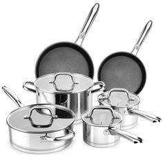 an assortment of pots and pans on a white background with the lid open to show them