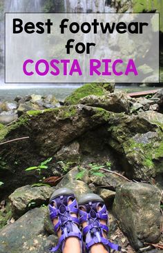 a person's feet in blue sandals standing on rocks with the words best footwear for costa rica