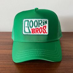 This Goorin Bros Trucker Hat Is A Must-Have For Any Hipster Or Streetwear Enthusiast. The Hat Features A Solid Green Color With A Mesh Back And Is Made Of A Polyester And Spandex Blend With A Canvas Fabric Type. It Is Adjustable And Breathable, Making It Perfect For Any Occasion, Whether It Be A Casual Day Out Or A Party/Cocktail Event. The Hat Is Also Lined With The Supercharged Capsule Of Mountain Dew, Adding An Extra Touch Of Style To The Classic Trucker Hat Design. This Hat Is Perfect For Me Cocktail Event, Mountain Dew, Hat Designs, Hats For Men, Green Colors, Trucker Hat, Accessories Hats, Canvas Fabric, Mens Accessories