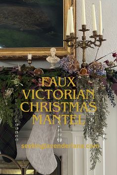 a christmas mantle with candles and stockings on it in front of a painting that reads faux victorian christmas mantel