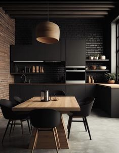 a modern kitchen with black walls and wooden table in the center, surrounded by chairs