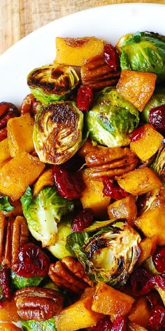 brussel sprouts, brussels sprouts and cranberries on a white plate