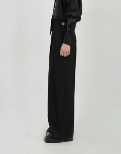 Elevate your wardrobe with the effortless sophistication of our Wide Leg Pleated Palazzo Trousers, complete with a sleek belt detail. These trousers are crafted from a premium polyester blend, offering both durability and comfort with a hint of stretch. The pleated design and wide-leg cut combine to create a fluid silhouette that exudes confidence, while the solid color and minimalistic style ensure they remain a timeless staple. The included belt not only accentuates the waist but also adds a structured element, making these pants versatile enough for casual outings or more formal affairs. Pair them with a tucked-in button-up shirt for a polished look or keep it relaxed with a soft tee and low-top sneakers. Product specifications: Material: 96% Polyester, 4% Spandex Fit: Loose, straight-l Elegant Belted Solid Wide Leg Pants, Elegant Solid Color Belted Wide Leg Pants, Tailored Versatile Formal Dress Pants, Chic Belted Wide Leg Workwear Pants, Chic Wide Leg Pants With Belt For Work, Elegant Wide Leg Pants With Belt, Chic Business Bottoms With Belt Loops, Versatile Formal Dress Pants, Elegant High Waist Belted Wide Leg Pants