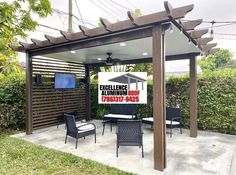 an outdoor patio with chairs and a television on the wall next to it that says excellence aluminum roof