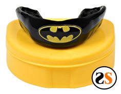 a batman helmet on top of a yellow box