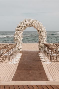 an outdoor ceremony set up on the beach