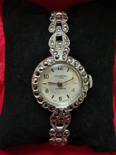 Amazing Jewels women watch Case size :2cm Thickness :8mm Max size wrist 20cm Type bracelet and case,, Marcasite" Manual Wind  Prophylaxis of watchmaker  Made in Britain Shockproof Very good condition Vintage Metal Round Jewelry And Watches, Vintage Hallmarked Watches For Evening, Vintage Silver Watches As Gifts, Vintage Silver Watches As A Gift, Vintage Silver Engraved Watch, Vintage Diamond Analog Watch For Formal Occasions, Silver Vintage Diamond Watch For Formal Occasions, Vintage Evening Diamond Watch With Round Dial, Vintage Metal Watch For Formal Occasions