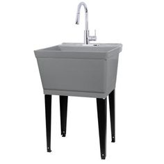 a sink with a faucet on the side and black legs, in front of a white background