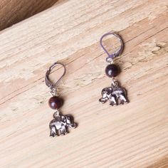 Little elephant earrings - Gemstone dangle bead and charm earrings  Cute, double sided grey metal elephants dangle from gorgeous brecciated jasper beads. A little over 3.5cms long including the stainless surgical steel lever back ear fittings. In stock and ready to ship Stainless surgical steel fittings are less likely to cause problems for metal allergy sufferers. Brecciated Jasper, Elephant Earrings, Grey Metal, Earrings Gemstone, Animal Earrings, Beaded Animals, Jasper Beads, Jasper Gemstone, Beaded Dangles