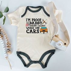 Introduce the little one to the world of automobiles and mechanics with this adorable bodysuit. Featuring a car-inspired design and a humorous message, it's perfect for a budding car enthusiast. Made with soft and comfortable fabric, it also makes for a great baby shower gift. Keywords : Auto Car Mechanic Baby Bodysuit, Car Enthusiast Baby Clothes, Funny Mechanic Dad Baby Apparel, Baby Shower Gift, Automotive Baby Outfit, Car Lover Infant Romper, Cute Baby Gearhead Onesie, Car-themed Newborn Clothing, Dad's Little Mechanic, Engineered for Cuteness, Vehicle Enthusiast Toddler Wear, Humorous Baby Clothing, Unique Baby Shower Present, Gearhead Family Fashion Baby Mechanic, Funny Baby Onesies Boy, Baby Clothes Funny, Dad Baby Shower Gift, Funny Mechanic, Fun Baby Announcement, Ivf Baby, Baby Announcement Pictures, Fall Baby Clothes