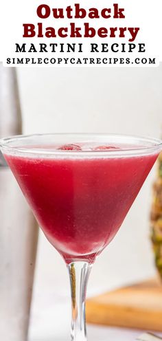 a red drink in a martini glass with the words, outback blackberry martini recipe