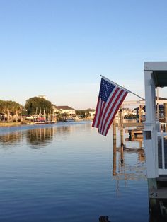 an american flag is hanging on the dock