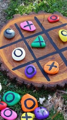 a tic - tac - toe board sitting in the grass