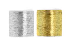 two spools of gold and silver thread