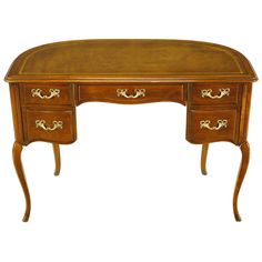 a wooden desk with two drawers on one side and an ornate design on the other