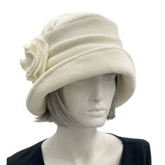 "An original design from Boston Millinery, handmade with care and attention to detail. The Alice cloche, a gorgeous winter hat for women, handmade in soft warm fleece. Inspired by both Downton Abbey and 1920's Style hats with a modern-day twist. Accessorized with a fleece brooch, the brooch is removable and can be worn anywhere you choose or switched out for a different embellishment. The hat can also be worn without the brooch as it is such a striking design. Unique, quality ladies hats handmad Cloche Hats, 1920's Style, Ladies Hats, Felt Hats, Unique Hats, Chemo Hat, Hat Ideas, Hat Women, Cloche Hat