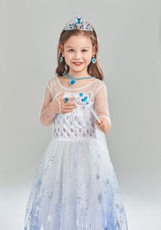 Transform into a princess with the Blue Princess Dress Costume Set! This high-quality satin and cotton blend costume is perfect for Halloween or as a Christmas gift. It's non-itchy, gentle on the skin, and comes with accessories. Suitable for parties, birthdays, and pageants, this true-to-size fit costume is a must-have for any princess fan. Blue Princess Costume Dress, Blue Princess Costume For Party, Ice Princess Costume Kids, Snow Princess Costume, Winter Princess Dress Kids, Princess Dress Costume, White Princess Dress, Blue Princess Dress, Costume Set