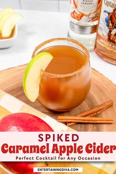 an apple cider with cinnamon sticks and apples in the background on a wooden tray