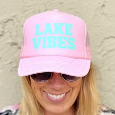 Lake Vibes Pink Trucker hat with blue font. Adjustable back strap and french terry head band. Lake Trucker Hat, Summer Baseball Cap With Sweatband, Summer Sports Hats With Letter Print, Sporty Hats With Letter Print For Spring, Sporty Letter Print Hats For Spring, Sporty Spring Hat With Letter Print, Trendy Snapback Hat For Sports, Sporty Adjustable Hats For Spring, Adjustable Summer Hat With Sweatband