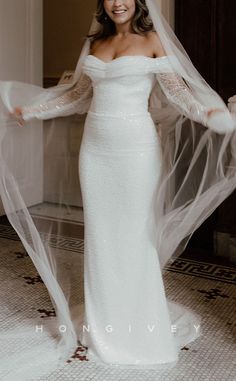 a woman in a white wedding dress and veil