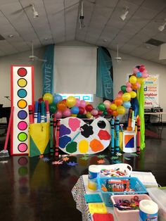 an art themed birthday party with balloons and streamers