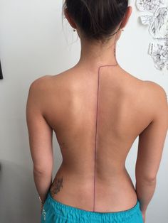 the back of a woman's upper body with lines drawn on her left side