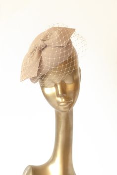 Please note that all items in my shop are made to order Unique Modern Beige Felt Fascinator. Decorated with beautiful French beige Veil Mounted with elastic rubber or headband Finished with lining and delicate petersham cotton grosgrain ribbon. If you need any info please contact me :) --------------------------- SHIPPING INFORMATION I will ship your purchased item within  7-9 business days after receiving payment to your address. Please note that shipping from Poland takes about 9 business days Fitted Wedding Fascinator With Pinched Crown, Wedding Fascinator With Pinched Crown, Fitted, Beige Fascinator For Wedding, Beige Fitted Fascinator For Wedding, Fitted Beige Fascinator For Wedding, Beige Hair Accessories For Wedding, Beige Fascinator For Ceremonies, Fitted Beige Fascinator For Vintage Events, Beige Fitted Fascinator For Ceremony