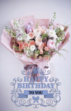 a bouquet of flowers with the words happy birthday to you