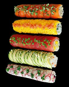 four different types of sushi on a black background