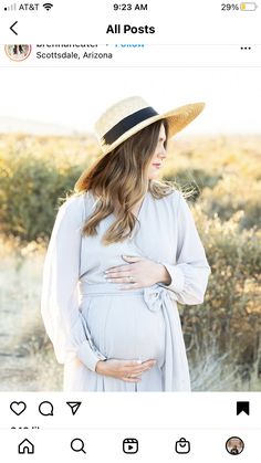 a pregnant woman wearing a hat in the desert