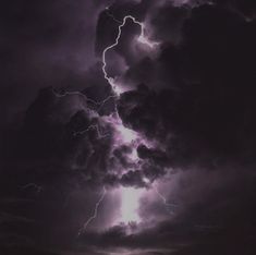 a lightning storm is seen in the sky