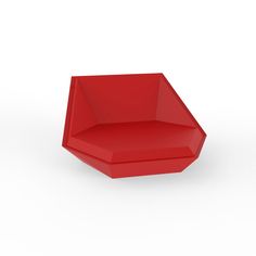 a red chair sitting on top of a white floor