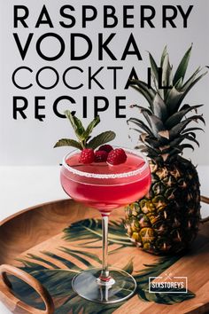 a pineapple and raspberry vodka cocktail on a tray with the words raspberry vodka cocktail recipe