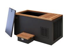 an ice chest sitting next to a wooden bench