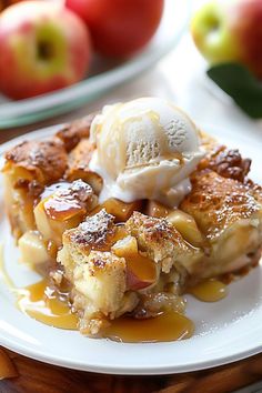 a piece of apple pie on a plate with ice cream and apples in the background