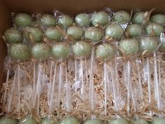 there are many green apples wrapped in plastic