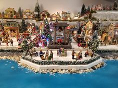 a christmas village with lots of holiday decorations