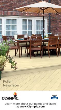 an outdoor dining table with chairs and umbrella