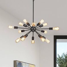 a chandelier with eight lights hanging from it's ceiling in a living room