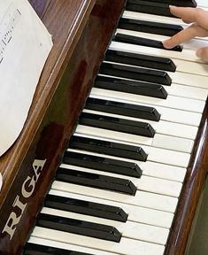 a close up of a person playing the piano