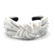 White Pearl Knotted Headbands for Women.  This handmade headband features white padded fabric and feature charming white studded pearl embellishments.  Each headband is custom-made and hand-studded with love, making it the perfect hair accessory for summer.  Whether you're shopping for the day or just want a festive hair accessory, this headband is the perfect addition to any outfit. Get yours today and show off your love for summer in style!   We always ask that you handle your headband with care.   Please do not give the headband to small children, as embellishments may fall off when and pose a choking hazard.    Saints Headbands Exclusive Designs  Shop All Headbands: https://www.etsy.com/shop/saintsheadbands/?section_id=29011254  Shop Saints Headbands: https://www.etsy.com/shop/saintshe Bohemian Headband, Wholesale Hair Accessories, Headband Women, Stylish Headbands, Vintage Hair Accessories, Top Knot Headbands, Cute Headbands, Knotted Headband, Velvet Headband