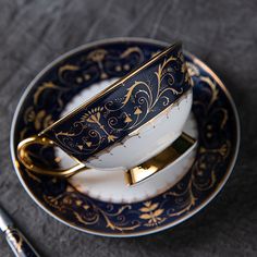 a cup and saucer sitting on top of a plate next to a fork,