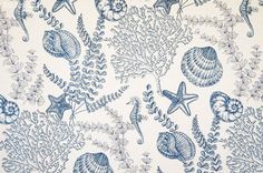 a blue and white wallpaper with sea animals, plants and seashells on it